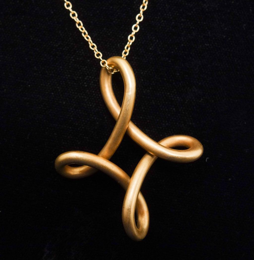 Tiffany Peretti 18K Matte Infinity Cross Necklace: Designer Elsa Peretti for Tiffany 18K yellow gold matte large infinity cross pendant necklace. It weighs 18.5g. The pendant is 1 5/8 x 1 1/4". The Peretti chain is 29 1/2" long.