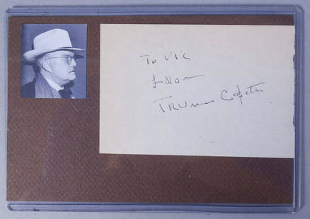 Truman Capote Autograph and Photo: A small photo of Truman Capote with an autograph: "To Vic From Truman Capote" This lot is inside a protective plastic sleeve. Total: 6 1/4"x4 1/4" Photo: ~ 1 3/8"x1 5/8" Autographed paper: ~ 4 1/8"x2