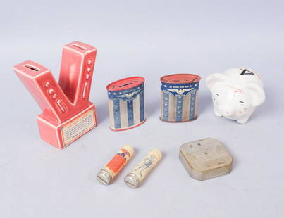 Lot of 7 WW2 Era Banks: One porcelain "cents 4 defense" piggy bank with Hitler caricature on the back. One porcelain "V" victory bank with label that says "Victory V Bank. Save your small change and buy more war savings