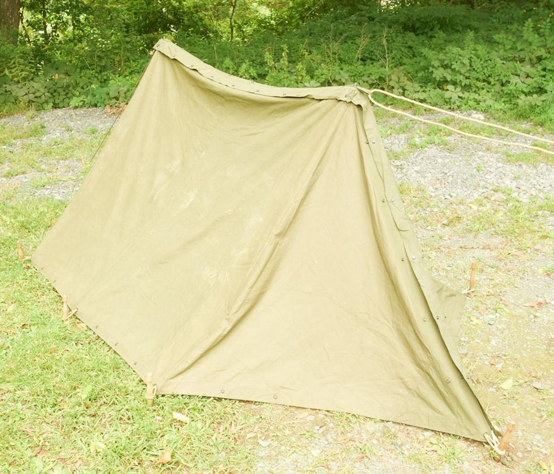 WW2 U.S. Field Tent: Pair of half tents with stakes, collapsible poles, ropes, and gas mask bag. Poles marked 1957. Assembled dimensions: 144" x 61" x 44"