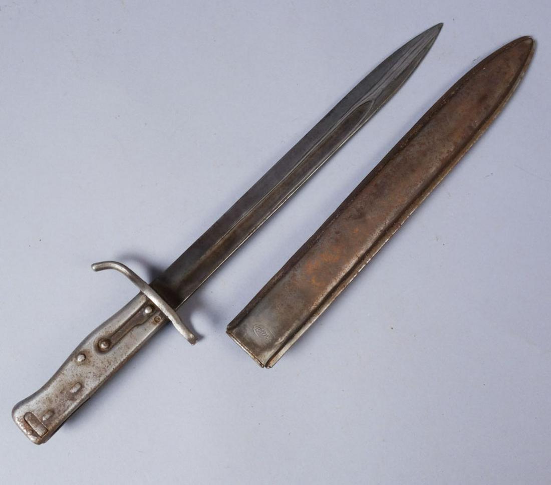 Antique WWI German Ersatz Bayonet: WWI German Ersatz bayonet with a crown over an "E" stamped on the side of the blade. Total 16 3/4, blade 12"