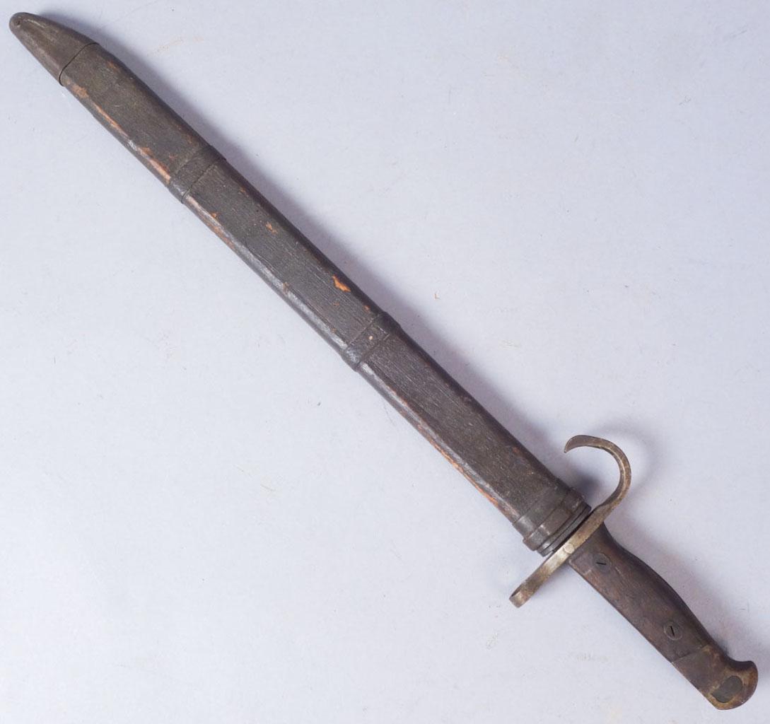 Japanese Type 30 Bayonet with Wooden Scabbard: Type 30 Japanese bayonet. Mark on blade associated with Nagoya Arsenal. Wooden sheath, no marks. Serial number on pommel 91838 with two unknown symbols next to serial number. Overall in scabbard: 20 3