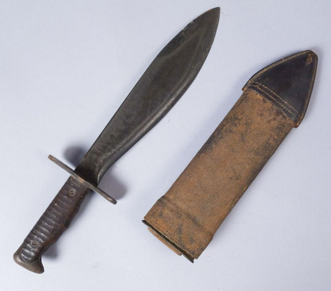 WWI US Army Bolo Knife: Blade stamped "US mod 1917 Plumb Phila 1918" with canvas and leather sheath. total length 15", blade10 3/8"