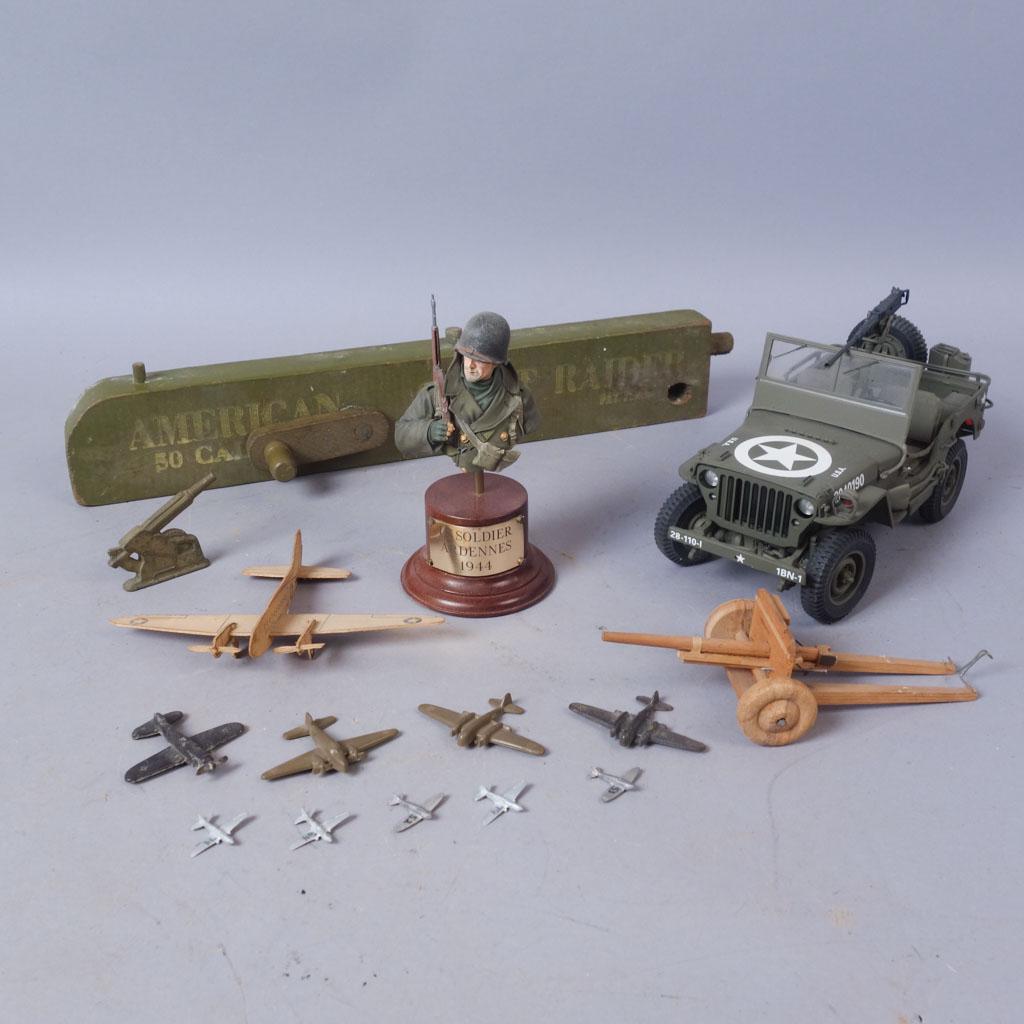 Lot of Military Toys incl. Kelloggs Model, Wood AA Gun: Lot of assorted military toys and figures including 9 miniature planes, 1 Kelloggs model Curtiss C-46, 1 wooden artillery cannon model, 1 cast metal cannon model, a bust of a US soldier labeled "US So
