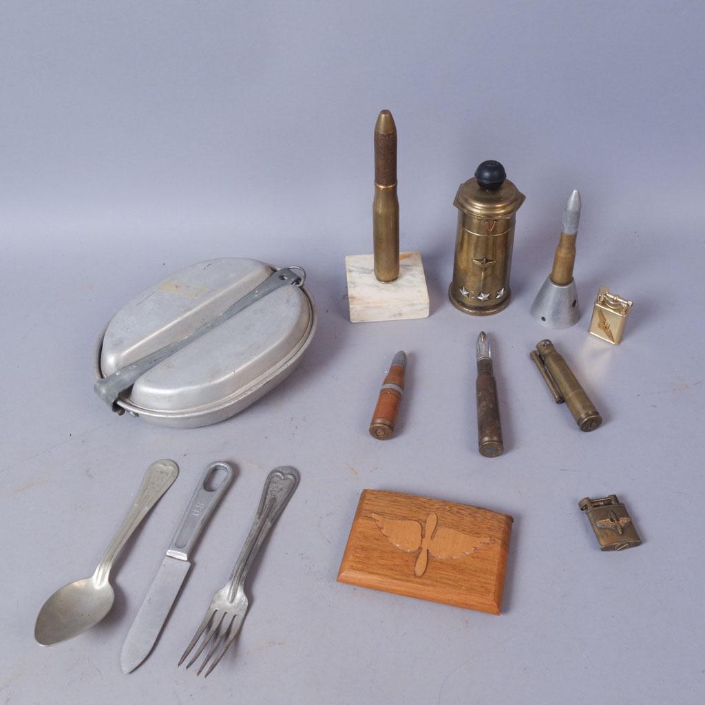 Lot of Trench Art Lighters, Cigarette Case, Mess Kit: 8 lighters of varying types and sizes, 1 full mess kit with utensils, and a wooden cigarette case. 1 small lighter has an Army Airforce crest on the front, and the other small lighter features a Naval