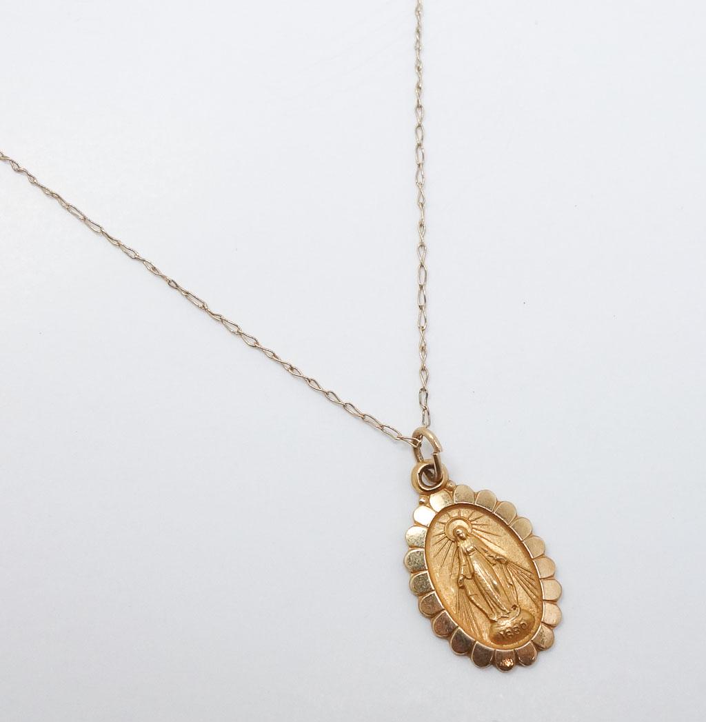 Vintage 14k Gold Miraculous Medal St. Catherine Pendant: The Miraculous Medal, also known as the Medal of Our Lady of Grace, is a devotional medal, the design of which was originated by Saint Catherine Laboure following her apparitions of the Blessed Virgin