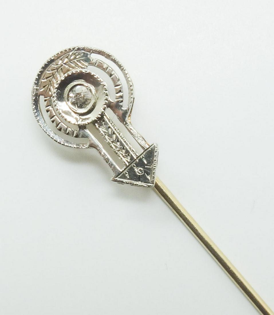 Edwardian 14k Yellow Gold & Platinum Diamond Stick Pin: This is a vintage stickpin. Rendered in fine 14k yellow gold and platinum, this pin features a single diamond. The pin is stamped 14k and bears an illegible mark. The pin stopper is brass and closes s