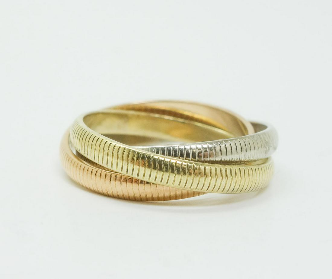 Cartier Trinity Tri-Color 18k Rose Gold Ring: This is a Cartier trinity tri-color ring. Rendered in fine 18k white, yellow, and rose gold. This ring features a simple ridged pattern. The rose gold ring is stamped 18k and the yellow gold ring is s