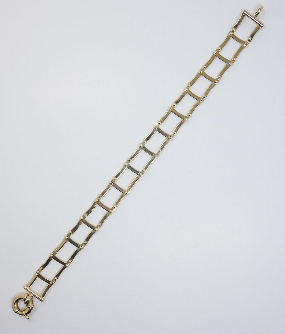 Unusual Vintage Jacob: This is an unusual Jacob's Ladder bracelet. Rendered in fine 14k yellow gold, it features a fully articulated ladder arrangement. It is stamped 14k, "Italy", and 100. 7 3/4" laid out.