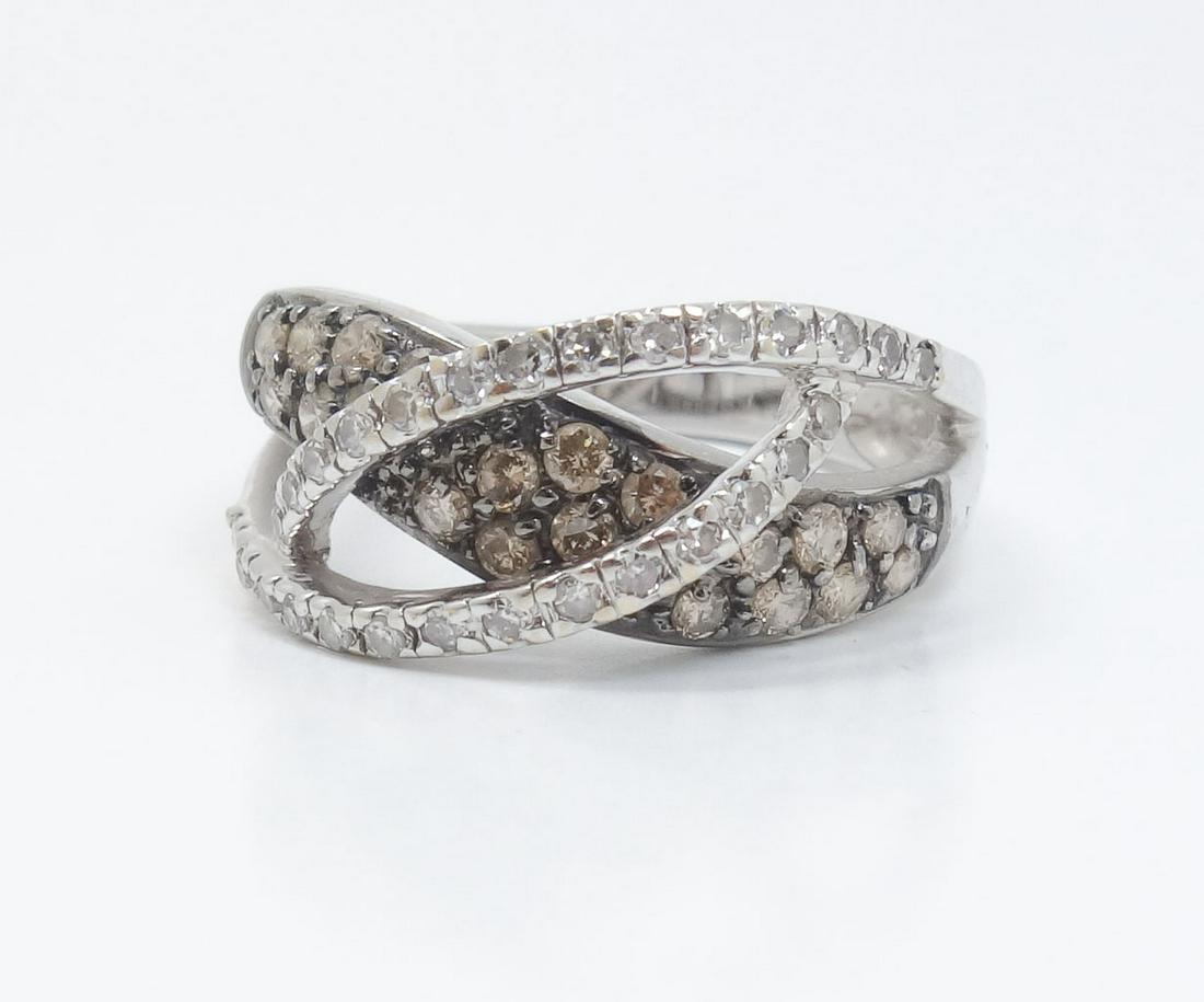Fine 18k White Gold Diamond Modern Design Ring Size 7: 18k white gold modern design ring set with single and full cut diamonds. The color of the diamonds ranges from G-H in the front to L-M in the back. Marked for 18k gold. The ring is a size 7US. The ran