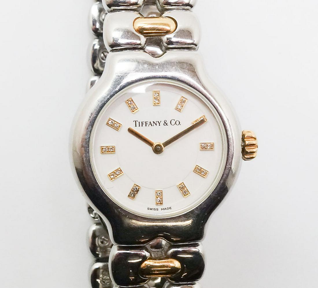 Tiffany Tesoro Diamond Dial 18k Gold Steel Quartz Watch: This is a Tiffany & Co - Tesoro ladies watch. Rendered in fine 18k gold and stainless steel, this watch features 24 single cut diamonds on the dial. The diamonds are VS in clarity and IJ in color. The
