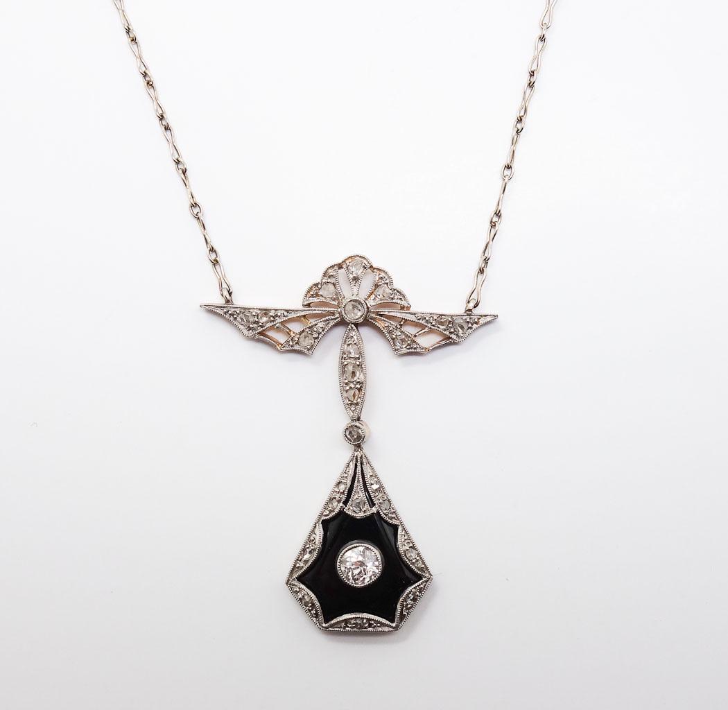 Antique French Diamond Onyx 14k Gold Platinum Lavalier: This is an antique Edwardian lavaliere necklace. Rendered in fine 14k gold and platinum, this necklace features an Old European cut diamond in an onyx setting. 17 1/2" necklace. Total weight 6.0g.