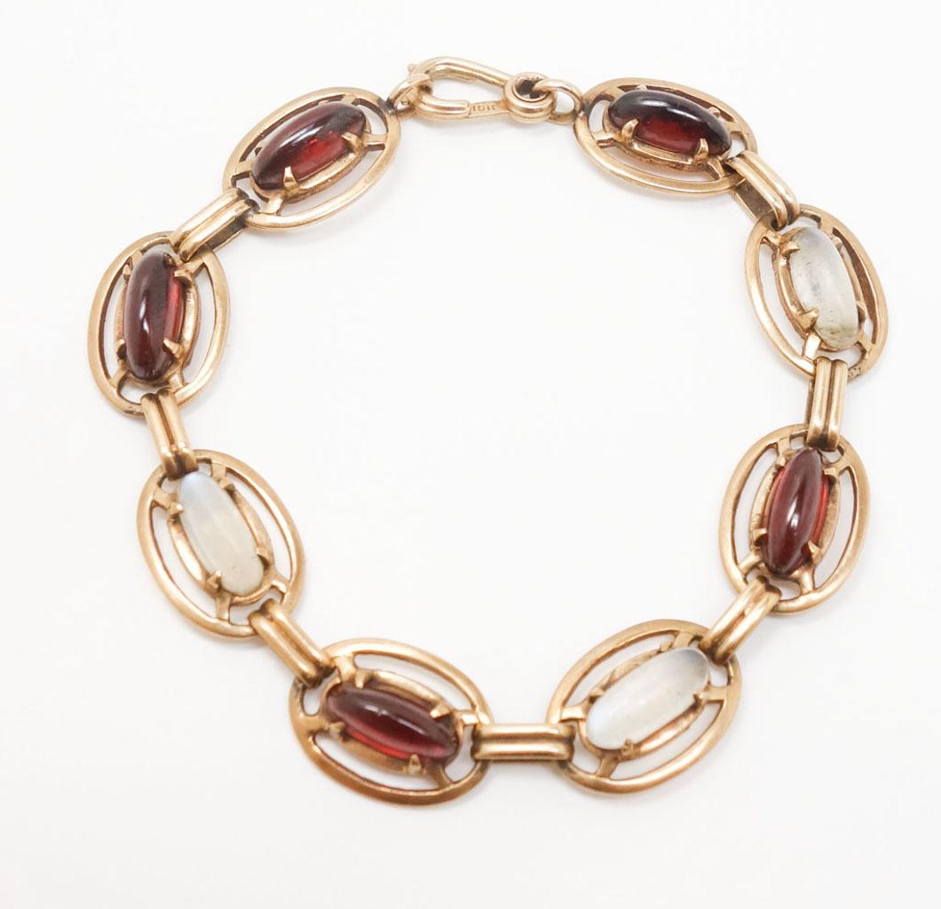 Antique Art Deco Rose Gold Moonstone & Garnet Bracelet: This is a charming and unusual estate found vintage bracelet dating to the early 20th century. Rendered in fine solid 10K rose gold, this Art Deco bracelet features garnet and moonstone cabochons. Mar