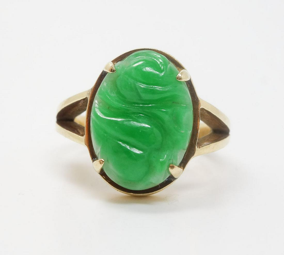 Chinese Export 14k Gold Carved Green Jadeite Ring 4.5: This is a gold and jadeite ring. Rendered in fine 14k yellow gold, it features a piece of jadeite with an abstract carving. The inside of the ring is stamped 585 and 14k. US Size 4 1/2. Total weight 5