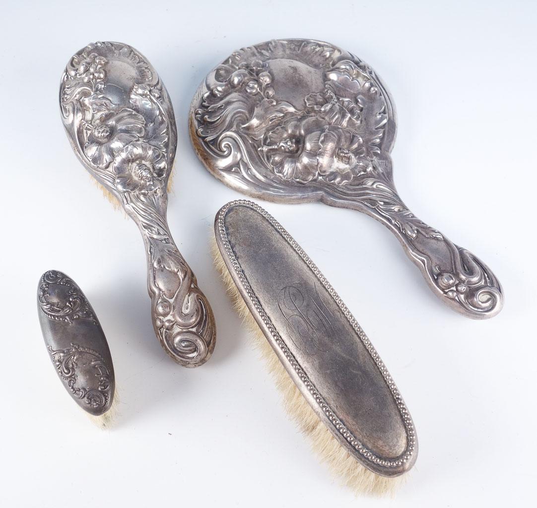 Art Nouveau Sterling Silver Brush Mirror Dresser Set: This is a beautiful estate found antique dresser set group dating to around the turn of the century. Rendered in fine sterling silver, these pieces display classic Art Nouveau designs. The mirror and 
