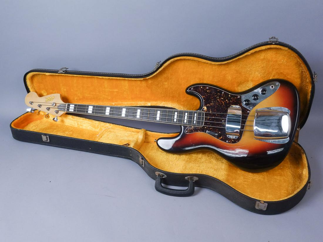 Aspen Electric Bass Guitar Sunburst Finish w Cables: Aspen electric bass guitar with hard case. The guitar features a sunburst finish and matching bridge and pickup guards. This instrument comes with a cleaning cloth and cables. Case:48 1/4"x 14"x 3 3/4
