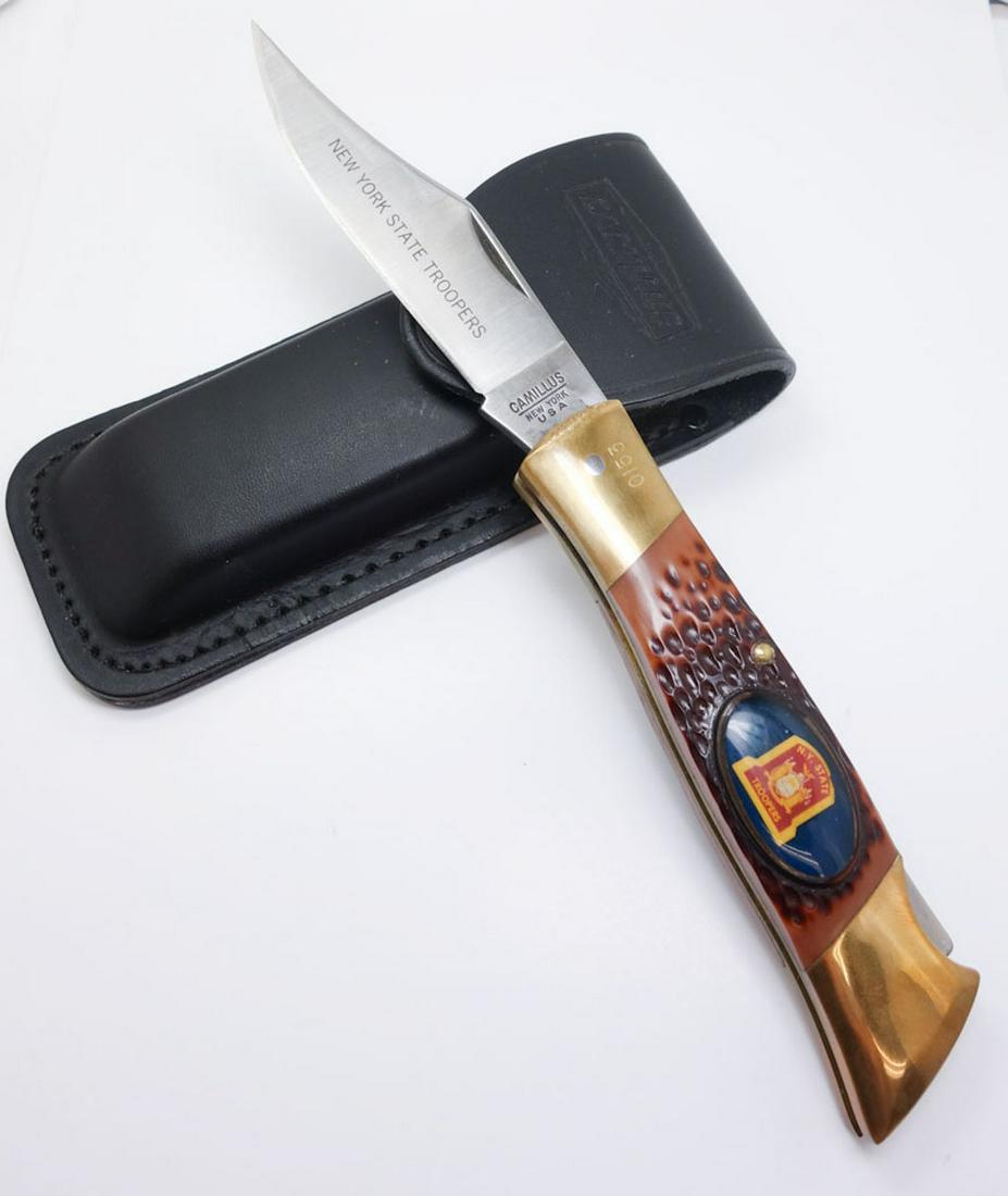 Vintage Camillus NYS Trooper Folding Knife w Sheath: This is a rare estate found vintage folding knife manufactured by Camillus of New York in the 1960s/70s. The handsome knife was made for a New York State Police Trooper. The handle features the crest