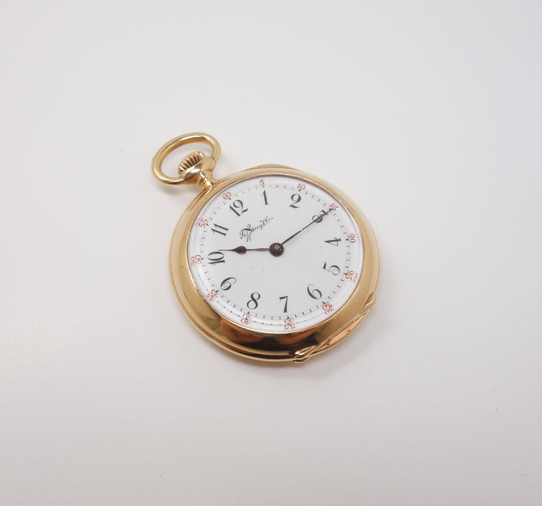 Tiffany & Co c1900 Swiss Ladies 18k Gold Pendant Watch: This is a lovely Tiffany & Co ladies pendant watch. Rendered in fine 18k yellow gold, it features a white dial with elegant black and red Arabic numerals. The inside of the case is stamped for 18k and