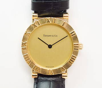 Fine Tiffany & Co 18k Gold Atlas Ladies Watch: A chic Tiffany & Co 18k gold Atlas watch. The watch weighs 31.5g The watch case measures 31mm x 31mm. The case including the crown measures 33.2. From lug end to lug end it measures 36.1mm. The