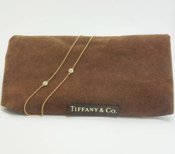 Tiffany Peretti Diamonds By The Yard 18K Gold Necklace: This is a contemporary Elsa Peretti for Tiffany & Co. "Diamonds by the Yard" necklace. Rendered in fine 18k yellow gold, it features 3 diamonds. The necklace is 20" long. It weighs a total of 2.2g.