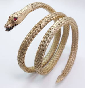 Early 20th C Silver Gilt Ruby Eye Mesh Snake Bracelet: An early 20th century silver gilt ruby eyed mesh snake bracelet. This bracelet weighs 26.5g. 2 1/2" x 3/4"