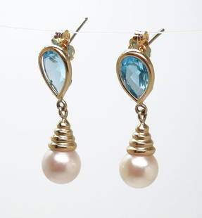 Contemporary 14k Gold London Blue Topaz Pearl Earrings: A pair of contemporary 14k gold London blue topaz and pearl earrings. The earrings weigh 3g. 25.5mm x 7.2mm x 7.3mm