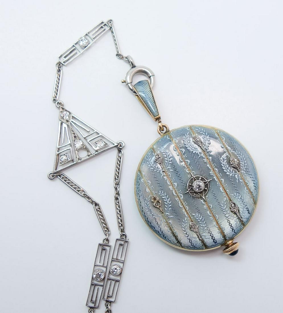 Longines 14K Guilloche Enamel Diamond Pendant Watch: This is a stunningly elegant estate found antique Longines ladies pendant watch dating to the early 20th century. Rendered in fine 14K gold, this watch features blue guilloche enamel details accented 