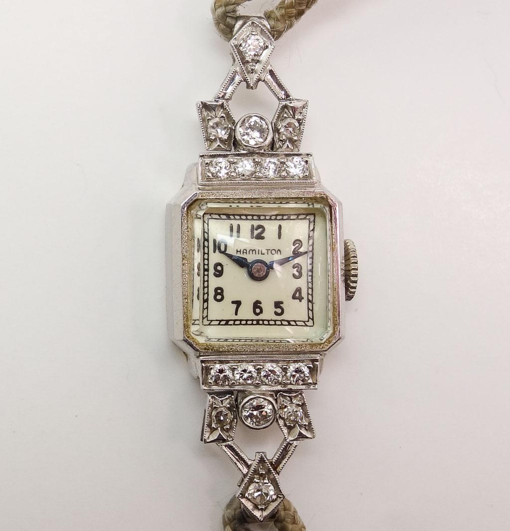 Good Vintage Hamilton Platinum Diamond Ladies Watch: A good Hamilton platinum and diamond ladies watch. This watch weighs 12g. The watch case measures 17.3mm x 13.4mm. The case including the crown measures 14.9mm. From lug end to lug end it measures 39.