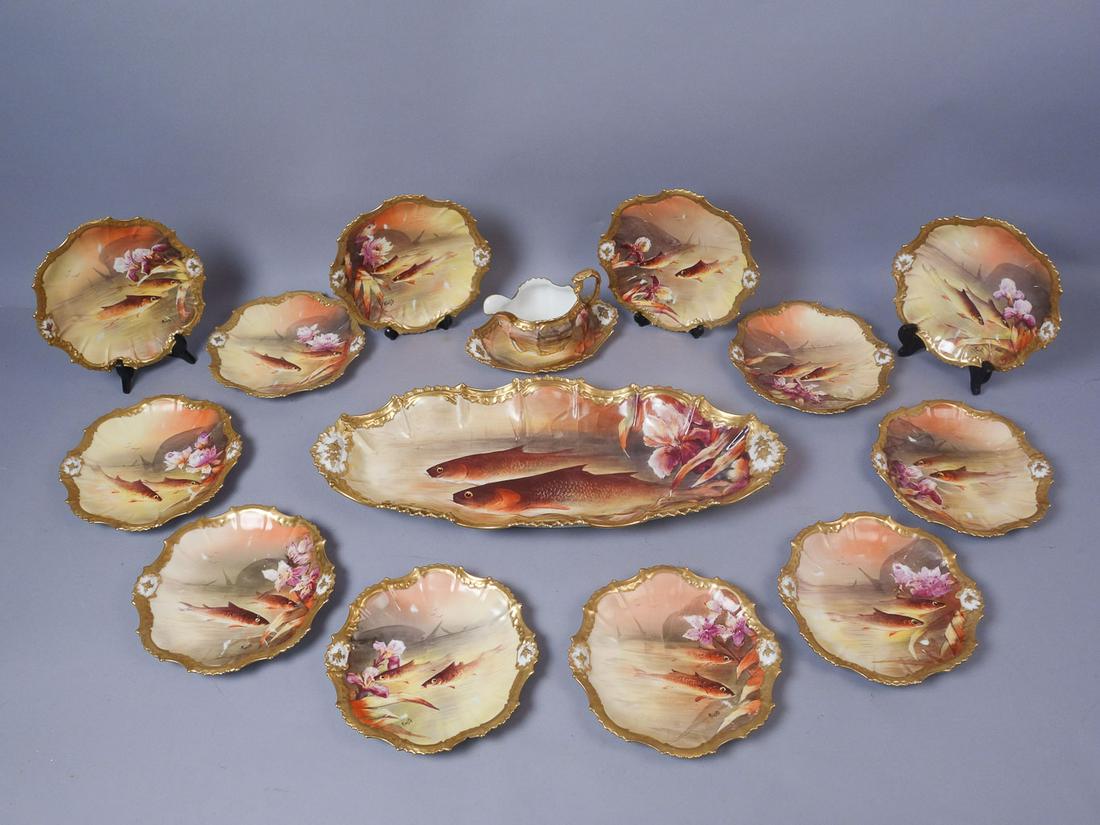 Limoges Porcelain Sunset Palette 15pc HP Fish Set: Antique 15 piece sunset palette Limoges fish service set. This set is comprised of 12 plates, a sauce boat with saucer, and a large platter. Each piece is signed "Muville" and features fish against a