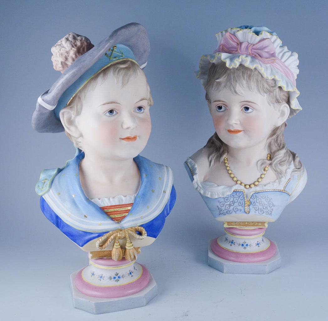 German Bisque Busts Children AWF Kister Signed R Moller: Pair of estate found antique bisque porcelain busts made in Germany in the19th century. Made at the factory of August Wilhelm Fridolin Kister, these busts were modelled and signed by Reinhard Moller. 