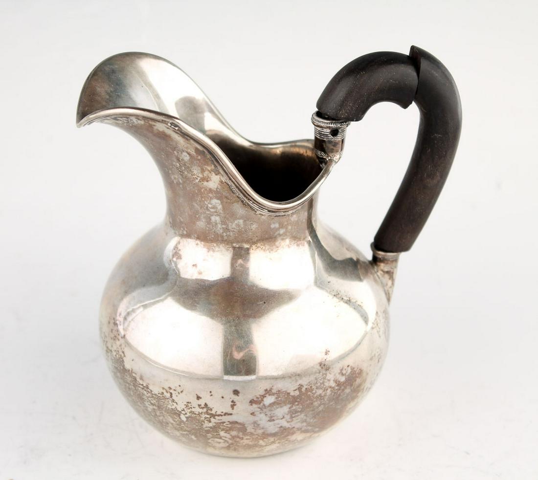 Early 19c Belgium Sterling Silver Empire Cream Pitcher: This is a beautiful antique sterling silver cream pitcher crafted in Belgium in the early 19th century. The elegant Empire form of the pitcher features a wide spout and delicate engraved design at the