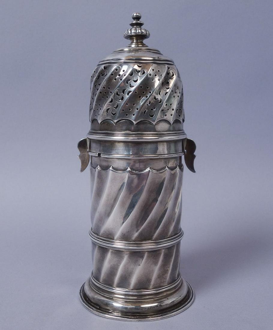 19c Gibson Langman Dublin Sterling Silver Sugar Caster: Ornate Pierced sugar caster from William Gibson and John Lawrence Langman of Dublin. Monogrammed "E.A.W" on the underside. 11.53ozt 8 1/4" x 3"