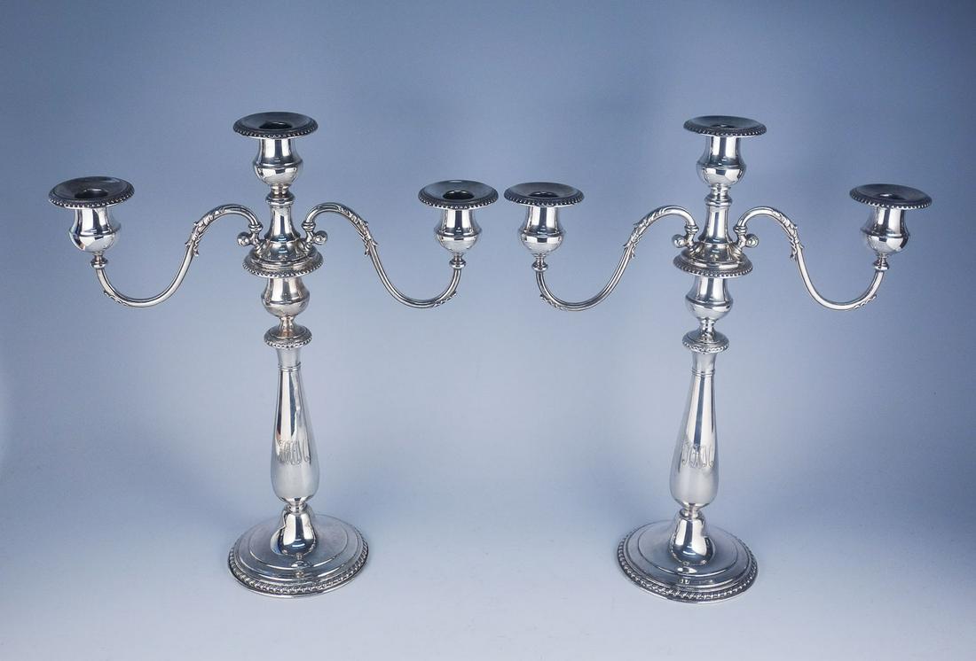 Pair of Sterling Silver Grogan 3 Light Candle Holders: Engraved with initials AHM. Bottom Engraved George III 1760-1820 Grogan Company Sterling 701-10. They are weighted. 14 1/2" x 12 1/4" x 4 1/2".
