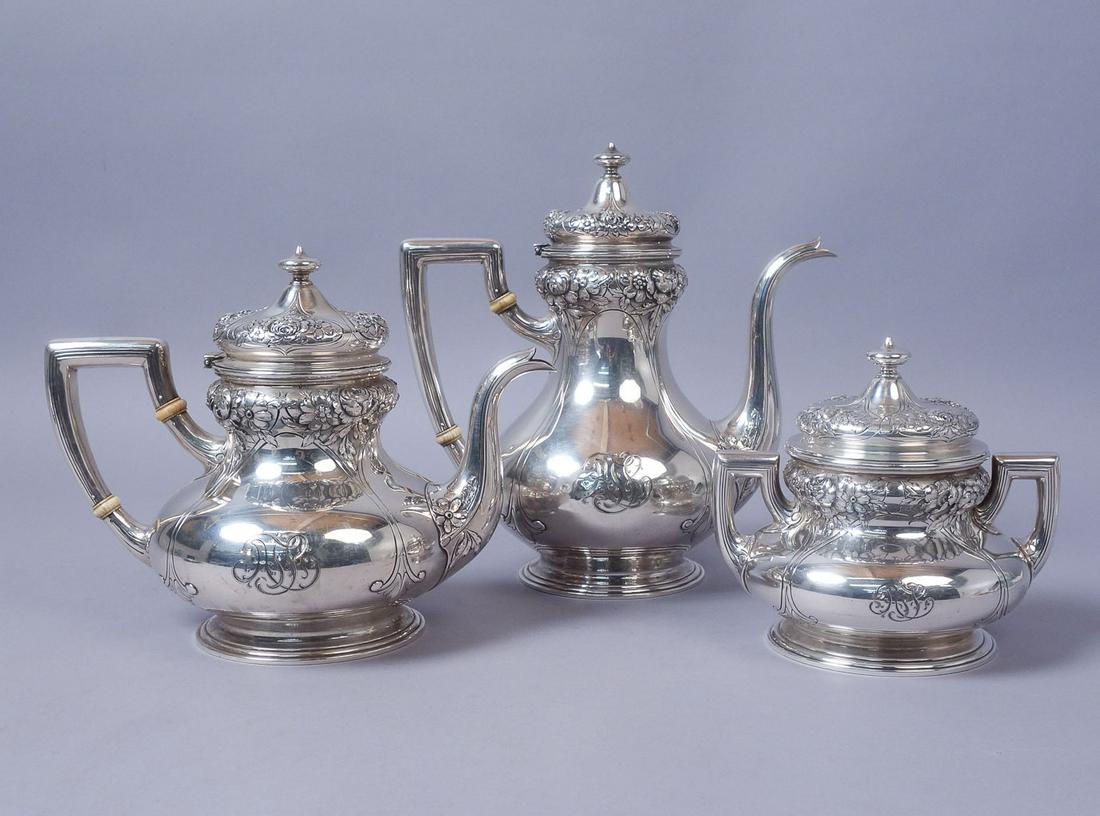 c1908 3pc Gorham Sterling Silver Floral Coffee Tea Set: Antique three piece tea and coffee set from the Gorham Manufacturing Company. Dating to circa 1908, the set includes a coffee pot, teapot, and covered sugar bowl. Each features ornate floral repousse