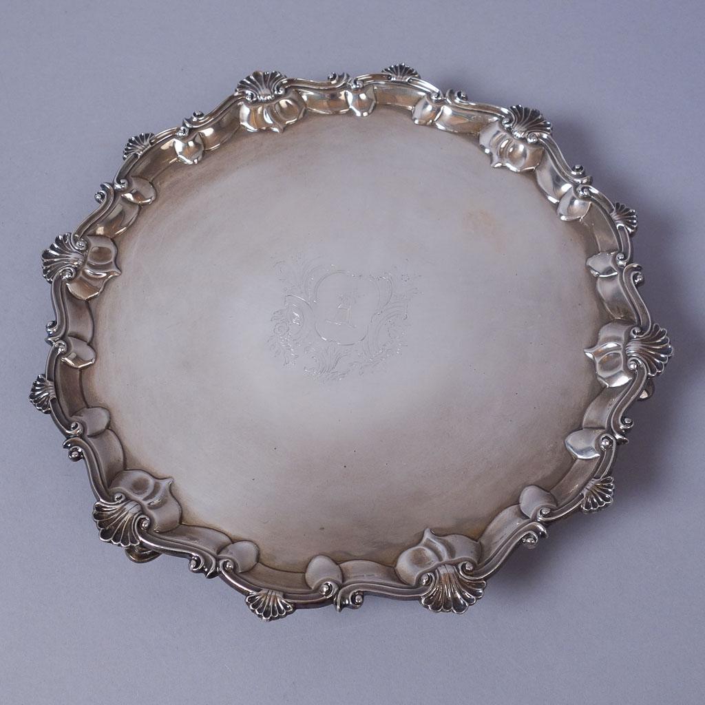 1768 London Sterling Silver Footed Heraldic Salver: Fine antique sterling silver footed salver dating to 1768. It is marked with the makers mark "JC". This particular marker's mark is attributed to a number of silversmiths working in London circa 1768 
