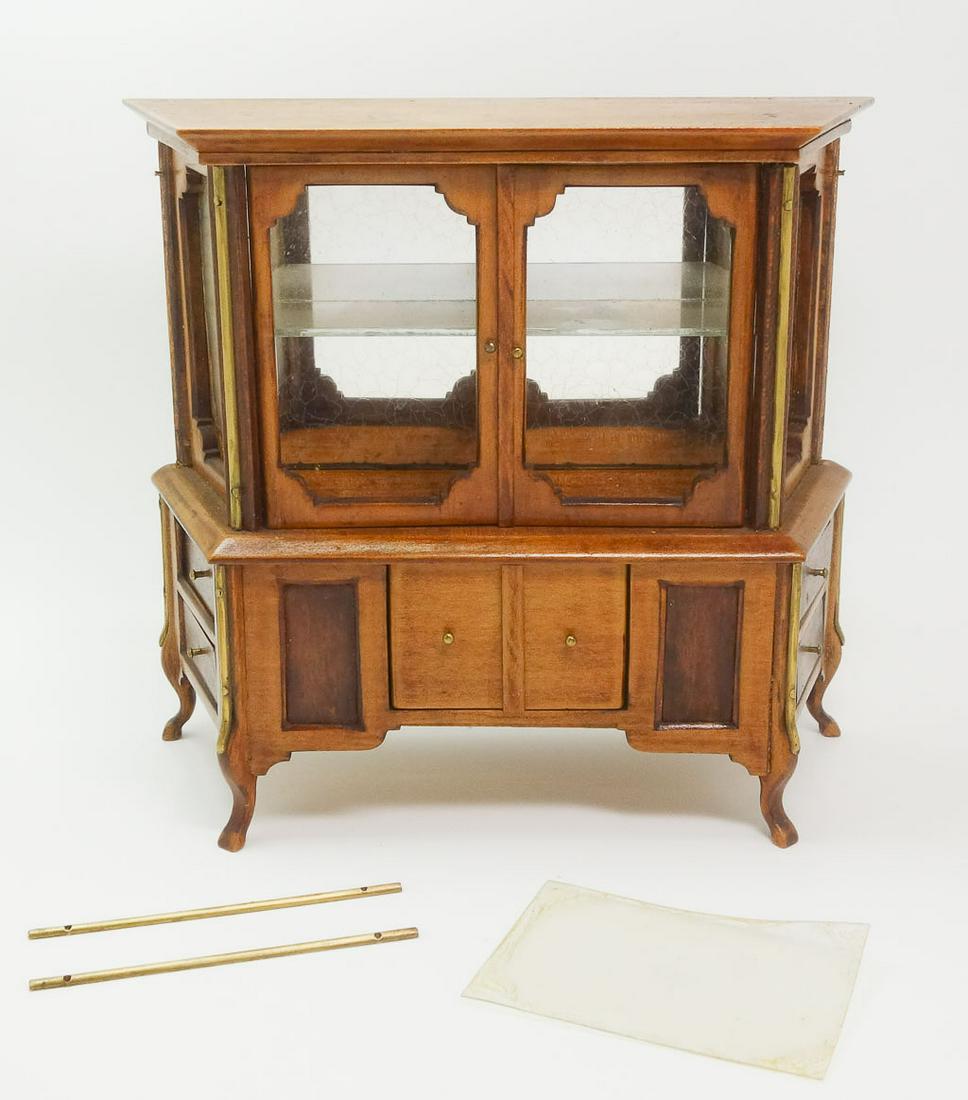 Miniature Dollhouse China Cabinet Cupboard w Mirror: This is a wonderful antique dollhouse china cabinet. It features a two-tone finish and has brass accents. The windows are clear plastic, and the mirror in the cabinet is glass. There are no visible ma