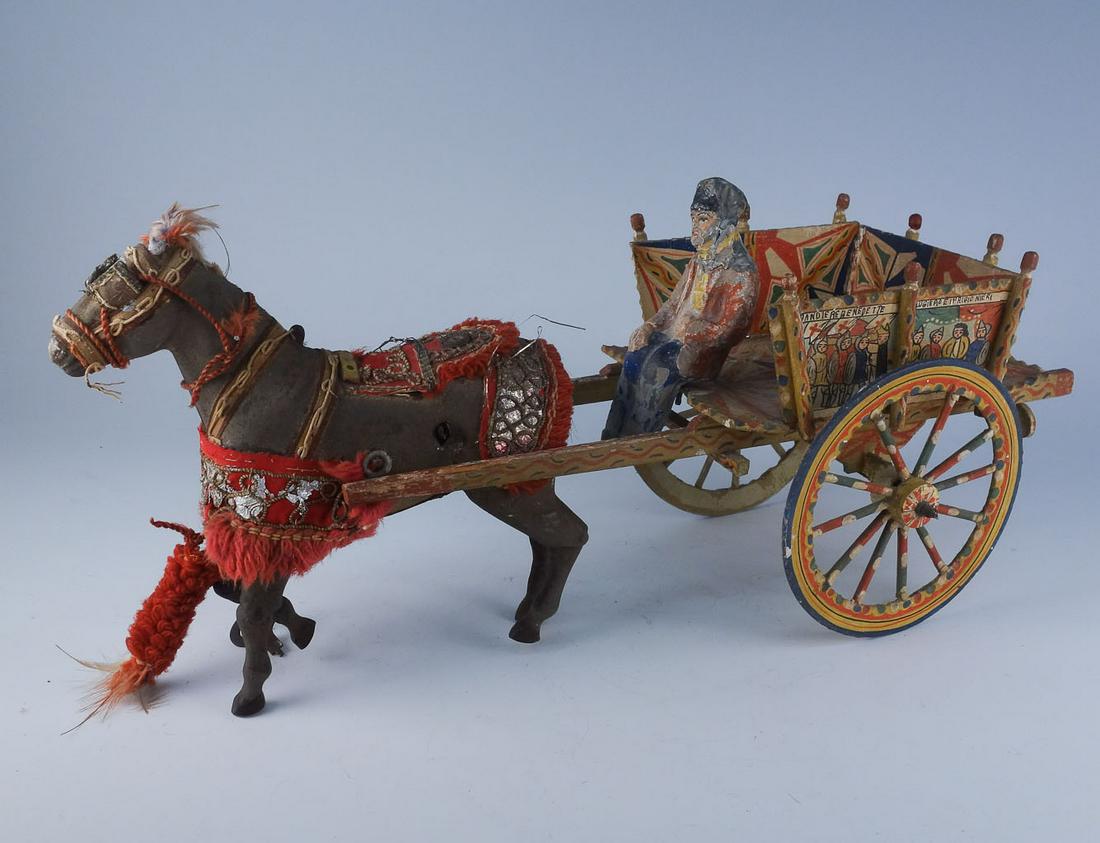 Antique Clockwork Horse Drawn Gypsy Wagon Cart Toy: The clockwork horse features bright red barding with metal leaf and small feathers throughout. The cart displays images on 4 surfaces. The left side of the cart is marked "Bandiere Benedette Rugiero E