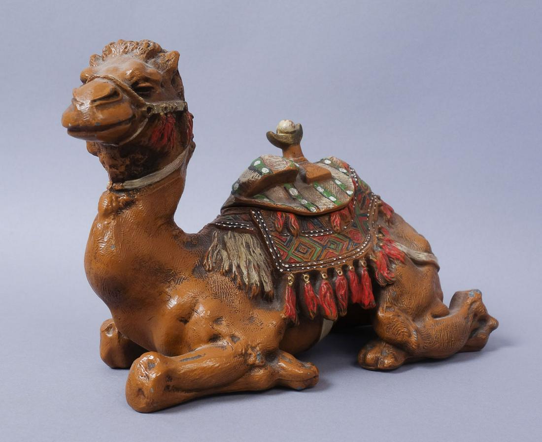 Antique Orientalist Polychrome Metal Camel Inkwell: This is antique Orientalist polychrome decorated white metal camel figurine and inkwell. Height 8"