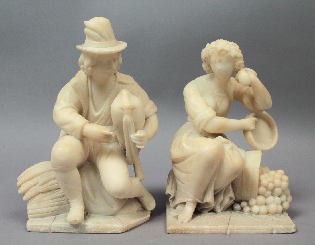Pair 19c Stone Bookends Harvester Peasant Man & Woman: This is a handsome pair of antique bookends dating to the 19th century. The pair of carved stone bookends feature a seated peasant couple. The man holds some bagpipes and the woman sits next to a barr