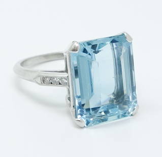 Fine 1930/40s 10.4ct Aquamarine Diamond Platinum Ring: A beautiful 10.4ct blue aquamarine ring flanked by three diamonds on each side in a platinum setting. It weighs a total of 8.6g. Ring size 7.25 US.