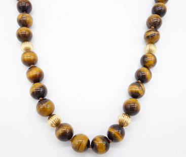 14K Gold Tiger's Eye Large Bead Single Strand Necklace: This single strand necklace is strung with 36 tiger's eye beads interspersed with 14K gold beads. The Tiger's Eye beads have a lovely chatoyancy and the strand is finished with a 14K gold filigree