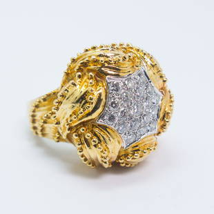 18K Yellow Gold Diamond Ladies Cocktail Ring Size 7: This vintage ladies cocktail ring is rendered in 18K gold. This ornate ring setting frames a cluster of 19 round brilliant cut diamonds. The ring is a size 7, it weighs 12.3dwt, and is 22mm in