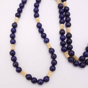 14K Gold Lapis Lazuli Single Strand Beaded Necklace: This single strand necklace contains 368 lapis lazuli beads interspersed with 14K gold beads. It is finished with a 14K gold clasp. This strand is 30" long, the lapis beads are 9mm each, and it