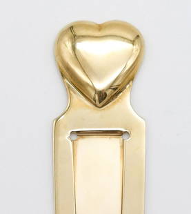 Tiffany Makers 14K Yellow Gold Heart Bookmark: A vintage bookmark from Tiffany & Co. Makers rendered in 14K yellow gold. This bookmark is topped with a heart finial. Accompanied by a Tiffany jewlery box. It is 3 1/4" long x 7/8". It weighs a