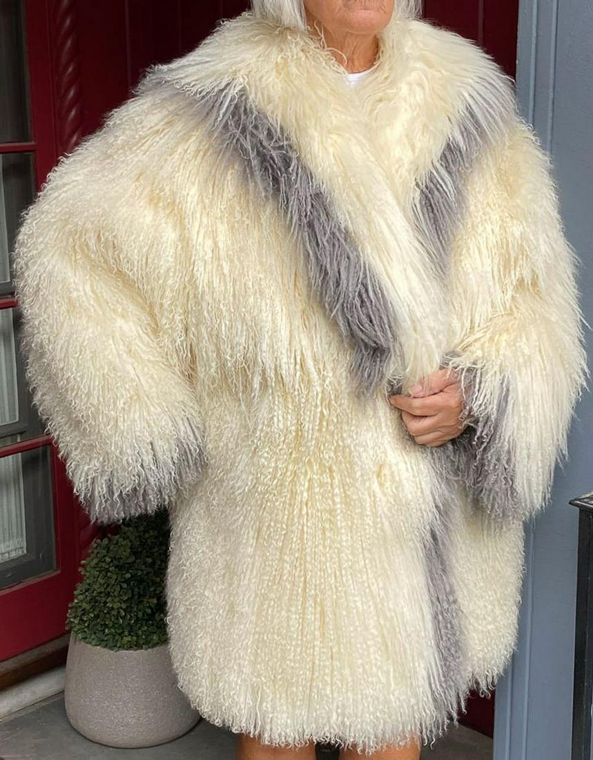 White Tibetan Lamb 3/4 Length Fur Coat Grey Trim c1985: A white Tibetan lamb 3/4 length fur coat that is elegantly trimmed in grey. Dates to circa 1985. Neiman Marcus label. Size large, plus.