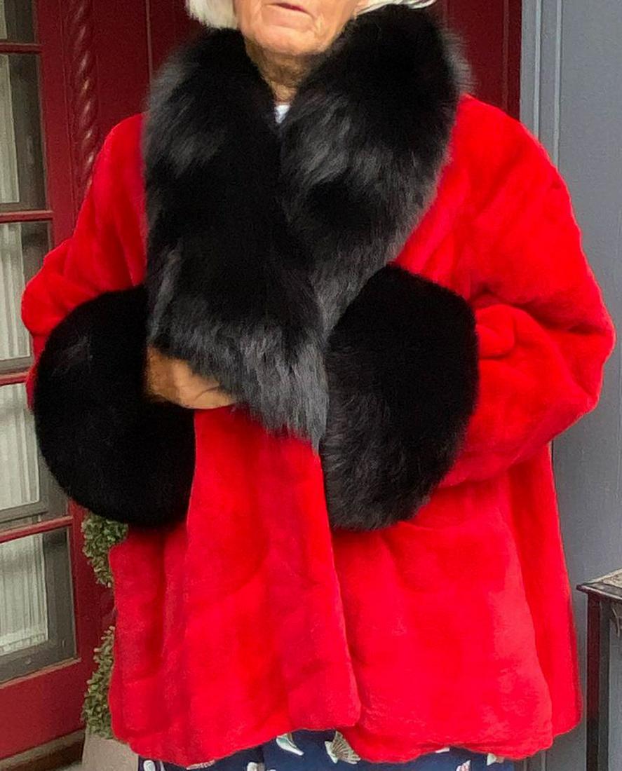 Red Sheared Mink with Black Fox Collar and Cuffs: This is a striking red sheared mink coat with black fox fur collar and cuffs. Beck Furs label on interior. Large, plus.