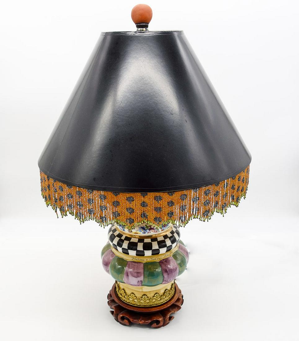 MacKenzie-Childs Hand Painted Lighthouse Lamp II: This is a whimsical handmade majolica "Lighthouse" lamp from MacKenzie-Childs Ltd. It features a delicate beaded trim on the shade. This lamp stands 26 1/2" tall.