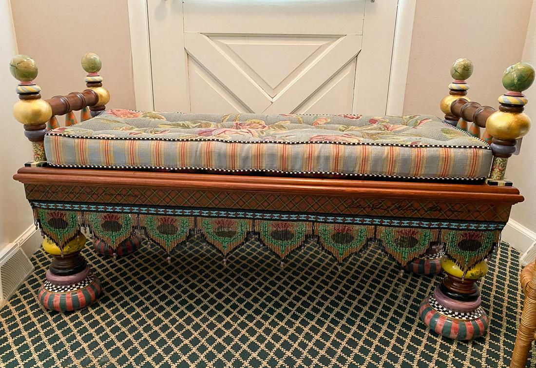 MacKenzie-Childs Upholstered Fringed Ridiculous Bench: This is a whimsical handmade and decorated "Ridiculous" bench from MacKenzie-Childs Ltd. It features an upholstered top and hand painted details. It measures 50 1/2 x 28 x 20".