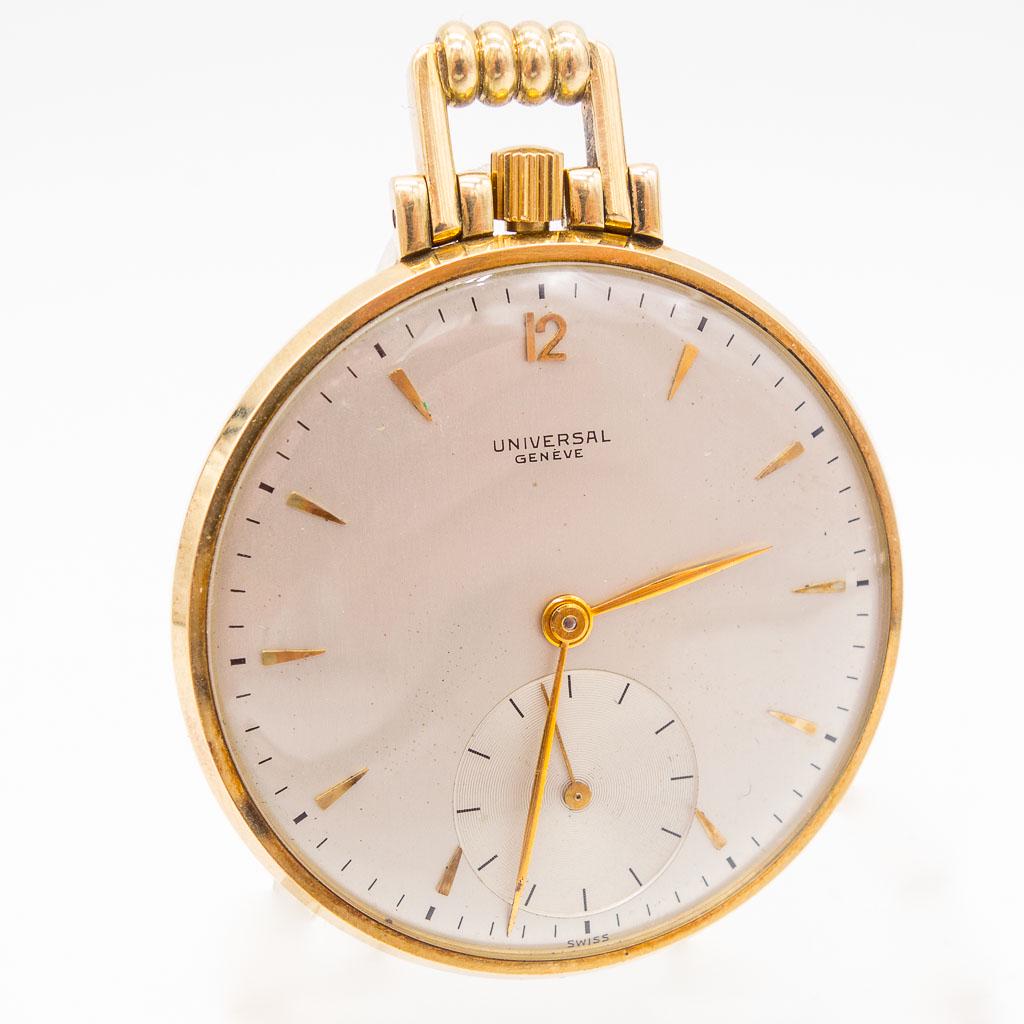 14K Gold Universal Geneve Pocket Watch: This 14K yellow gold manual wind Universal Geneve pocket watch features a a silver stick dial. This watch measures 43mm and weighs 28.0dwt.