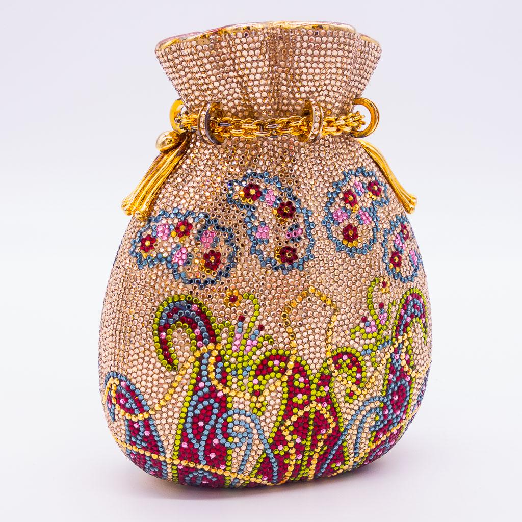 Judith Leiber Hard Case Jeweled Satchel-Shaped Purse: This Judith Leiber hard shell jeweled drawstring satchel-shaped purse features a colorful paisley pattern with gold-tone findings. Inside the bag is a gold-tone mirror, coin purse, and chain strap. It